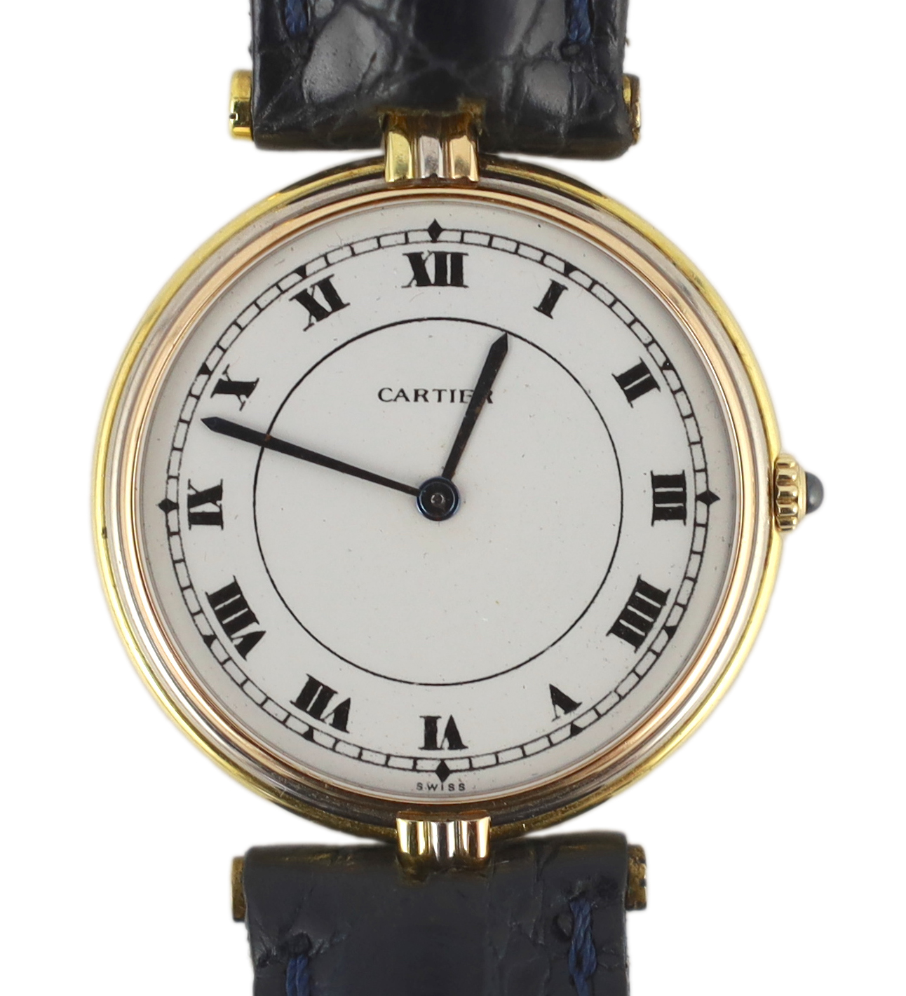 A lady's modern Cartier 18k gold quartz wrist watch, on associated leather strap and buckle